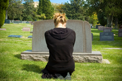 sad-woman-at-grave